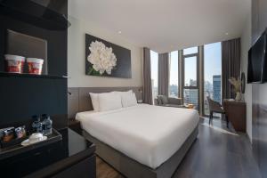 Voodi või voodid majutusasutuse Everland Hotel toas