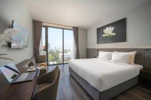 Voodi või voodid majutusasutuse Everland Hotel toas