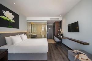 Voodi või voodid majutusasutuse Everland Hotel toas