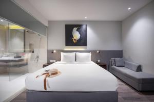 Voodi või voodid majutusasutuse Everland Hotel toas