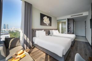 Voodi või voodid majutusasutuse Everland Hotel toas