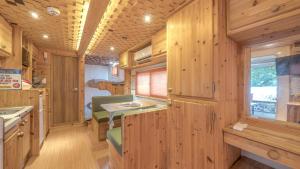 a kitchen with wooden paneled walls and wooden counters at Club Lespia in Pocheon Baegun Valley in Pocheon
