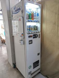 a white refrigerator with its door open in a room at Shima Stay holoholo in Zamami