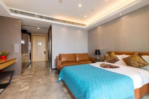 Letto o letti in una camera di Yoyo Apartment Jiedeng Metropolis Branch, Beijing Road