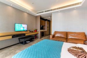 TV o dispositivi per l'intrattenimento presso Yoyo Apartment Jiedeng Metropolis Branch, Beijing Road