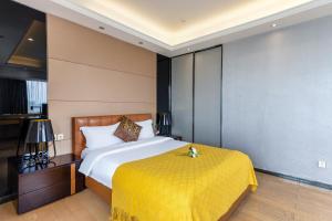 Letto o letti in una camera di Yoyo Apartment Jiedeng Metropolis Branch, Beijing Road