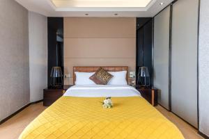 Letto o letti in una camera di Yoyo Apartment Jiedeng Metropolis Branch, Beijing Road