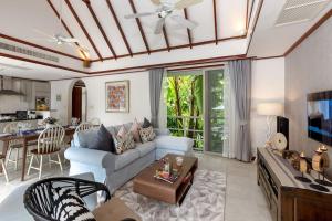 a living room with a couch and a table at Katamanda 3 Bed Tropical Villa B3 Near Kata Beach in Kata Beach