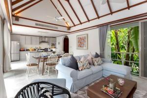 a living room with a couch and a table at Katamanda 3 Bed Tropical Villa B3 Near Kata Beach in Kata Beach
