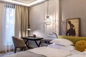 Posteľ alebo postele v izbe v ubytovaní Hotel Traugutta3
