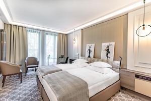 Posteľ alebo postele v izbe v ubytovaní Hotel Traugutta3