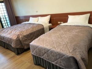 Letto o letti in una camera di Lohas Seaview B&B
