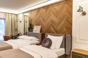 Posteľ alebo postele v izbe v ubytovaní Hotel Traugutta3