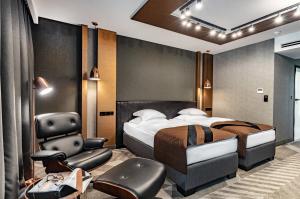 מיטה או מיטות בחדר ב-Hotel Traugutta3