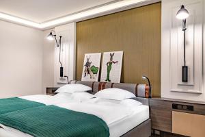 Posteľ alebo postele v izbe v ubytovaní Hotel Traugutta3