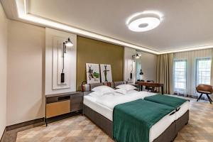 Posteľ alebo postele v izbe v ubytovaní Hotel Traugutta3