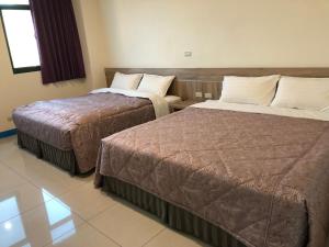 Letto o letti in una camera di Lohas Seaview B&B