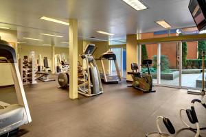 a gym with several treadmills and elliptical machines at Belltown Court Space Needle Studio in Seattle