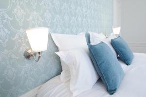 Postel nebo postele na pokoji v ubytování Villa Clément Appart'Hotel