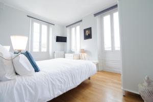 Postel nebo postele na pokoji v ubytování Villa Clément Appart'Hotel
