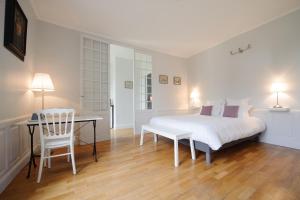 Postel nebo postele na pokoji v ubytování Villa Clément Appart'Hotel