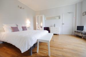 Postel nebo postele na pokoji v ubytování Villa Clément Appart'Hotel