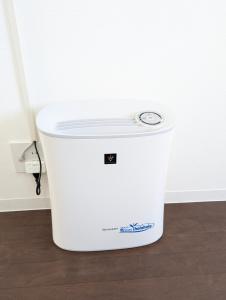 a large white ice bucket sitting on the floor at Shima Stay holoholo in Zamami