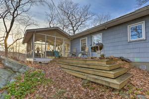 a house with a large deck in front of it at Cozy Garrison Home, 11 Mi to Bear Mountain! in Garrison