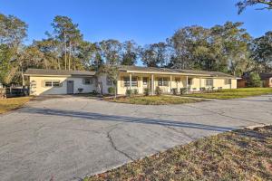 a house with a driveway in front of it at Spacious Family Home w/ Backyard in Gainesville! in Gainesville