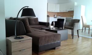 a living room with a couch and a table at Oro Apartments in Petrovac na Moru