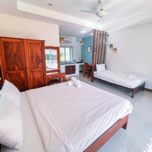 Cama o camas de una habitación en Ther เธอ Villa พูลวิลล่าปราณบุรี