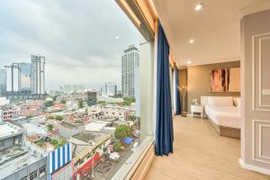 Ashley Sabang Jakarta客房内的一张或多张床位