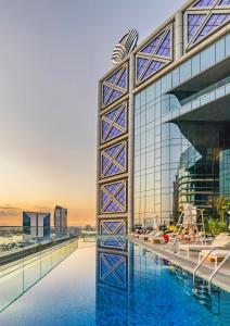 a view of a building with a swimming pool at Al Bandar Rotana – Dubai Creek in Dubai