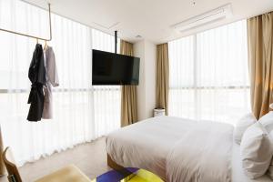 Postel nebo postele na pokoji v ubytování Yangju Hotel Ippda