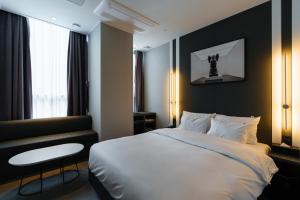 Postel nebo postele na pokoji v ubytování Yangju Hotel Ippda