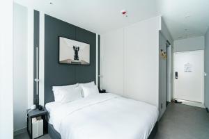 Postel nebo postele na pokoji v ubytování Yangju Hotel Ippda