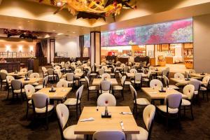 a dining room filled with tables and chairs at Eureka Casino Resort in Mesquite