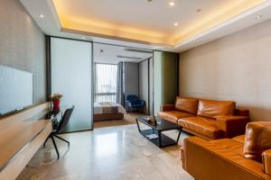 Area soggiorno di Yoyo Apartment Jiedeng Metropolis Branch, Beijing Road