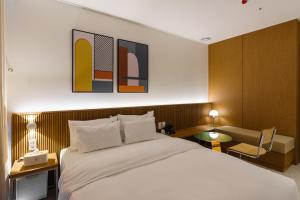 Postel nebo postele na pokoji v ubytování Yangju Hotel Ippda