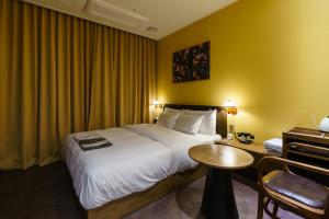 Postel nebo postele na pokoji v ubytování Yangju Hotel Ippda