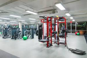 a gym with a lot of equipment in it at Luxurious stay near the Beach in Newport Beach