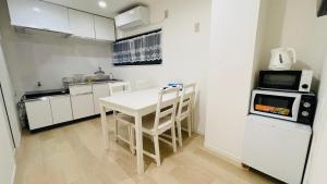 Η κουζίνα ή μικρή κουζίνα στο Ogi-Ohashi Apartment +23 φωτογραφίες
