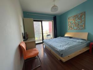 Postel nebo postele na pokoji v ubytování 合家欢