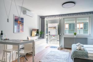 a kitchen and living room with a table and a window at Home sweet Home in Budapest