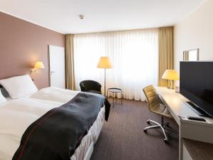 Postel nebo postele na pokoji v ubytování DORMERO Hotel Dessau-Roßlau + 22 fotografií