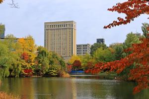 a view of a pond in a city with buildings at Hotel Lifort Sapporo in Sapporo