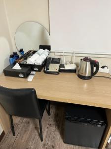 Fasilitas pembuat kopi dan teh di Ekonomy Hotel