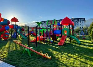 a park with a playground with a slide at ЦО Novel Иссык-Куль in Korumdy