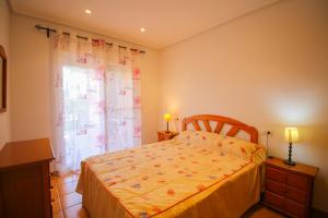 A bed or beds in a room at El Rinconcito