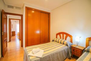 A bed or beds in a room at El Rinconcito